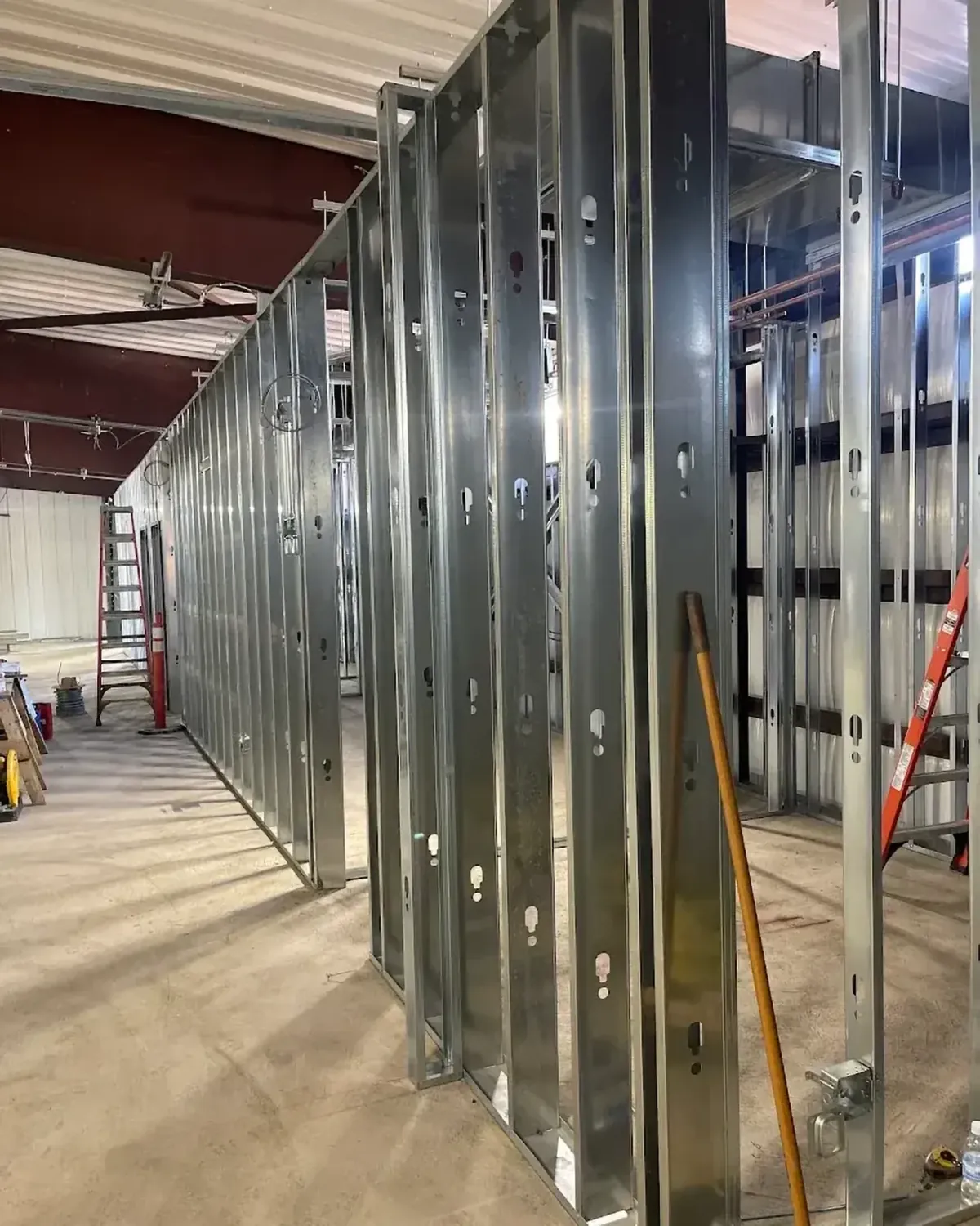 A long run of steel stud framing in a commercial space
